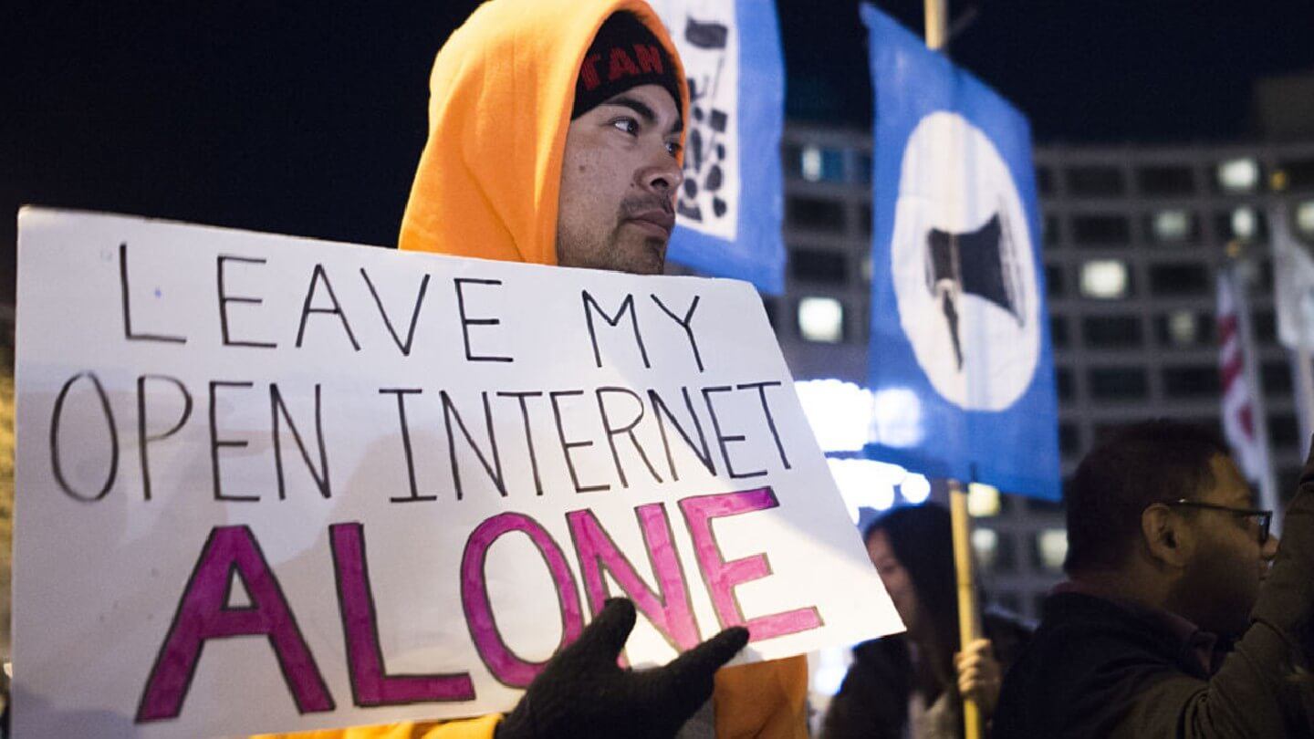 A small group of protestors supporting net neutrality protest against a plan by Federal Communications Commission (FCC) head Ajit Pai, during a demonstration on December 7, 2017 in Washington.