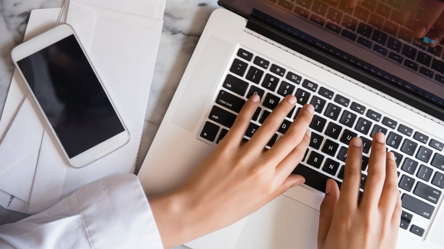 Image of hands typing on a keyboard