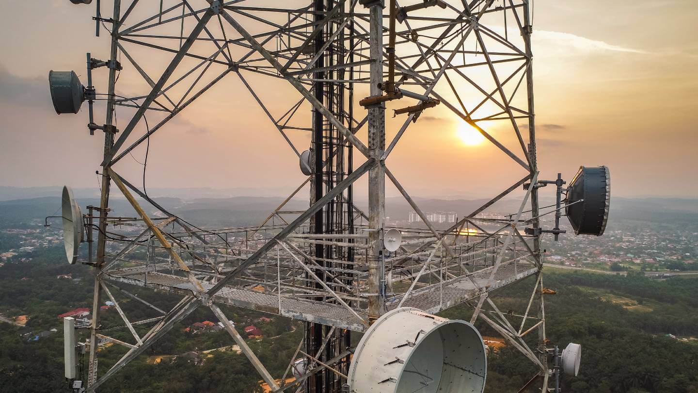 Photo of a telecommunication tower at sunset
