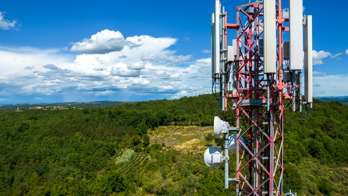 5G tower overlooking wooded area.