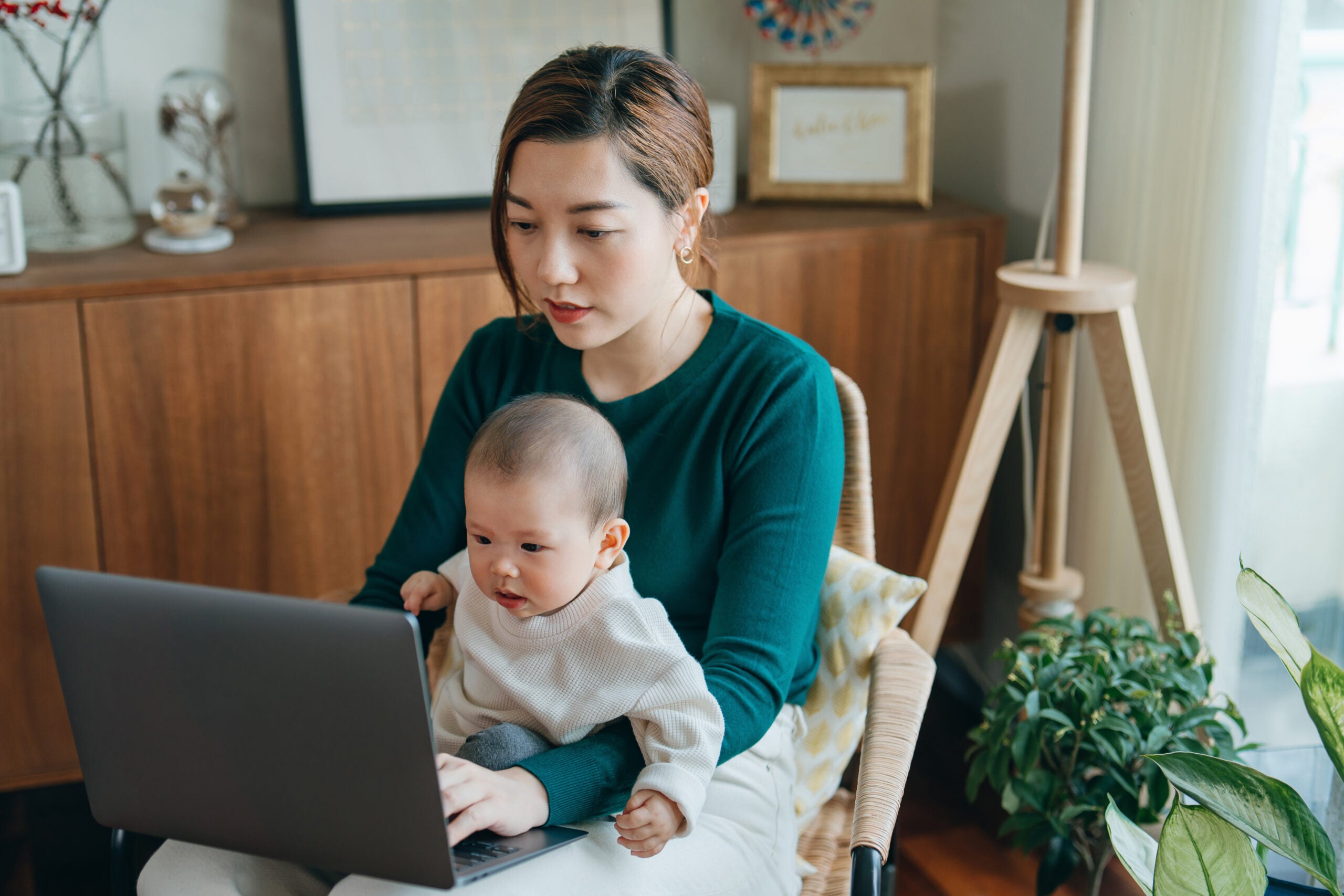 woman with baby on computer